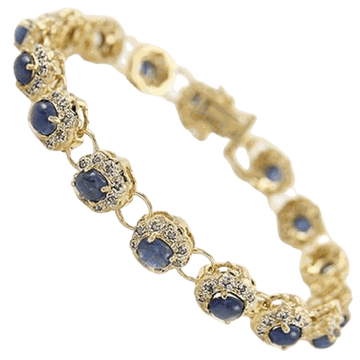18K yellow gold diamond and sapphire bracelet with deep blue oval sapphires and round diamonds