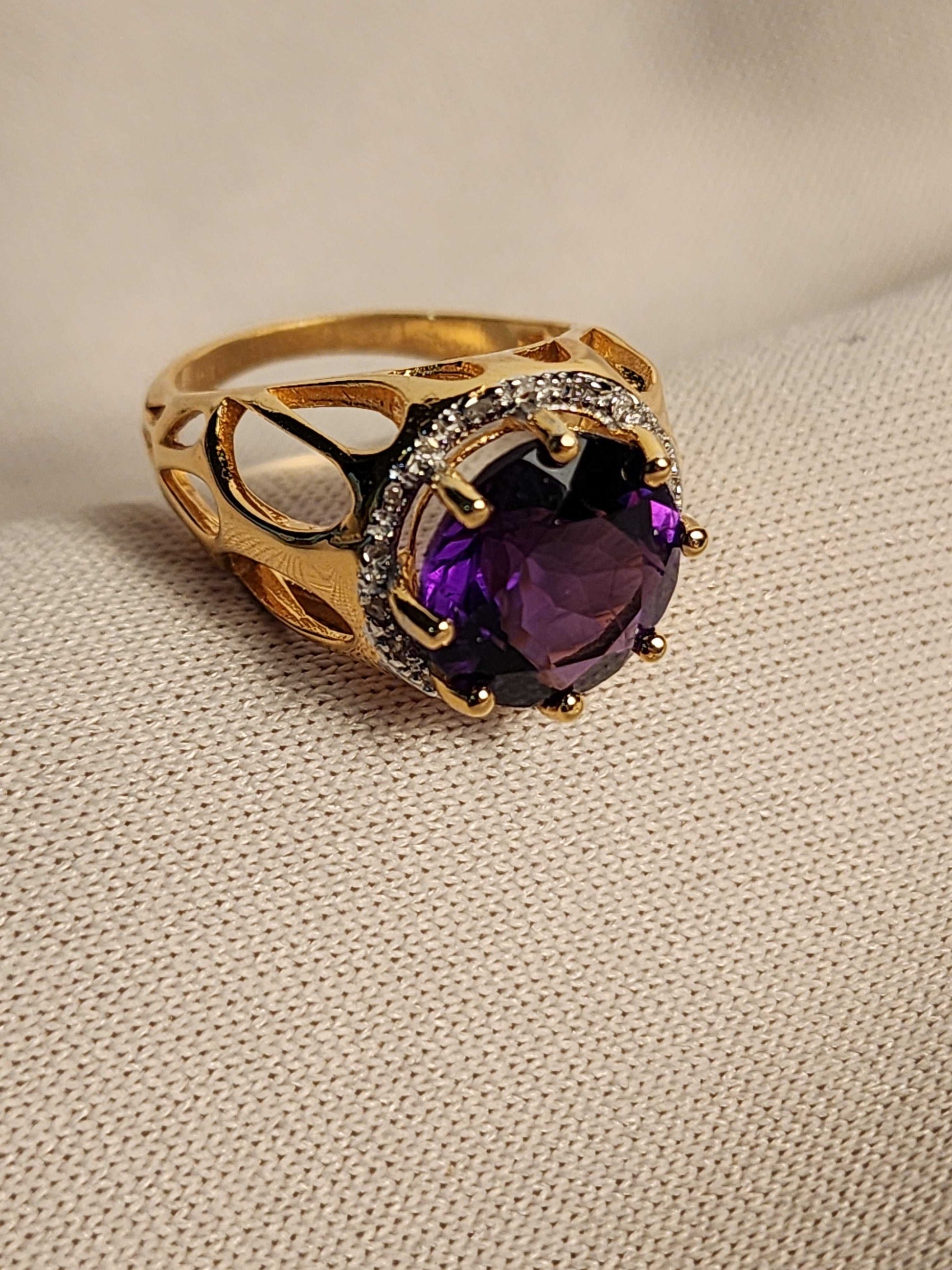 Beautiful amethyst ring with 5.50 CTW purple amethyst and 18 diamond accents in 14K yellow gold plated sterling silver, size 7