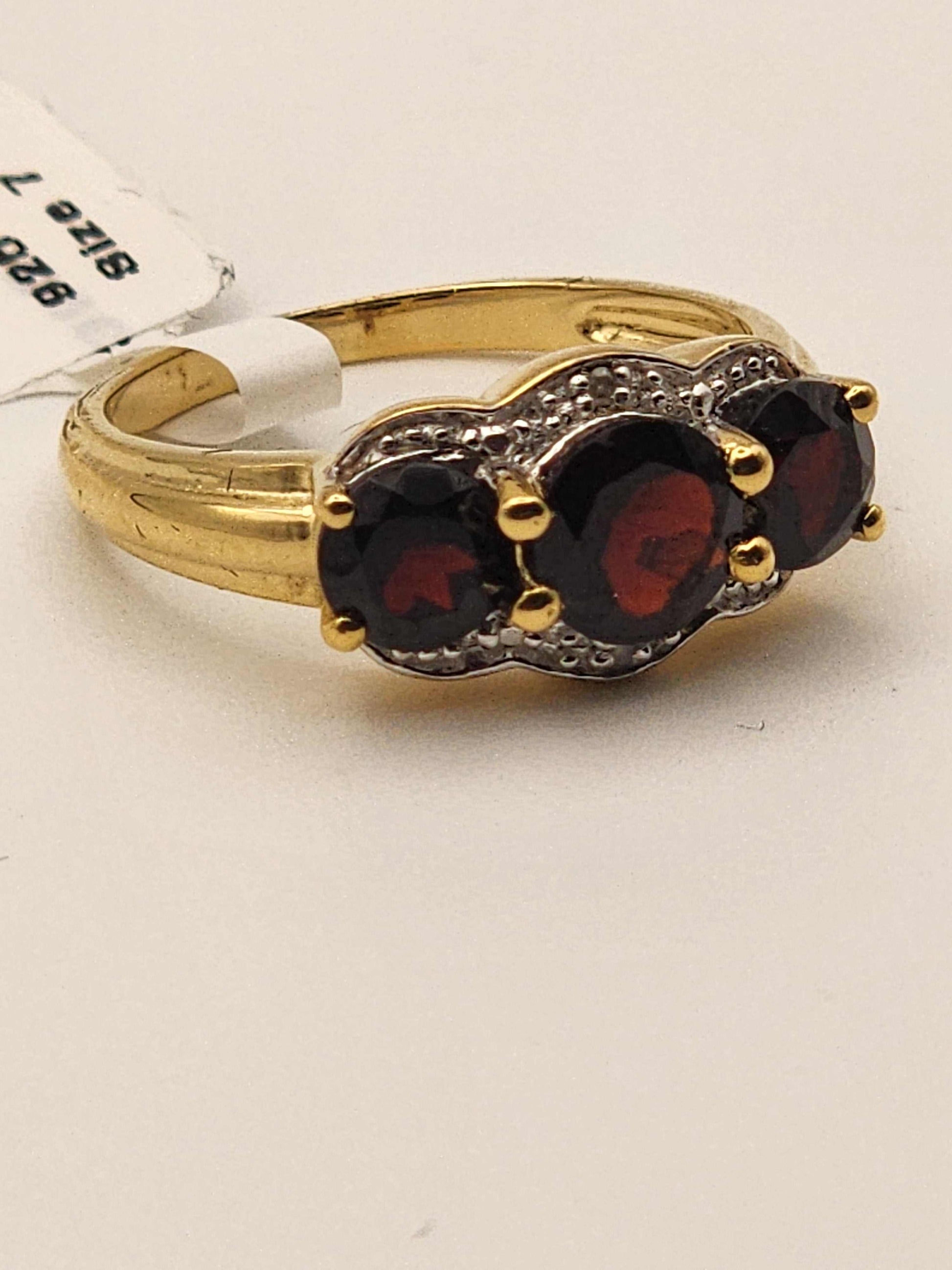 Women’s 14K yellow gold over sterling silver ring with 2.3 carat garnet and diamond, size 7