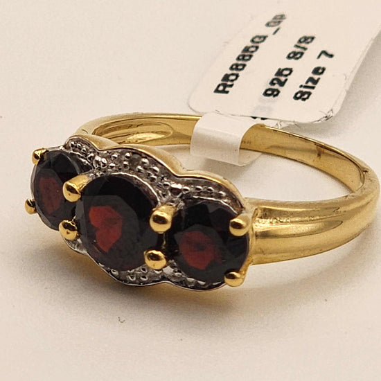 Women’s 14K yellow gold over sterling silver garnet and diamond ring size 7 with 2.3 carat round-cut garnet and diamond accent