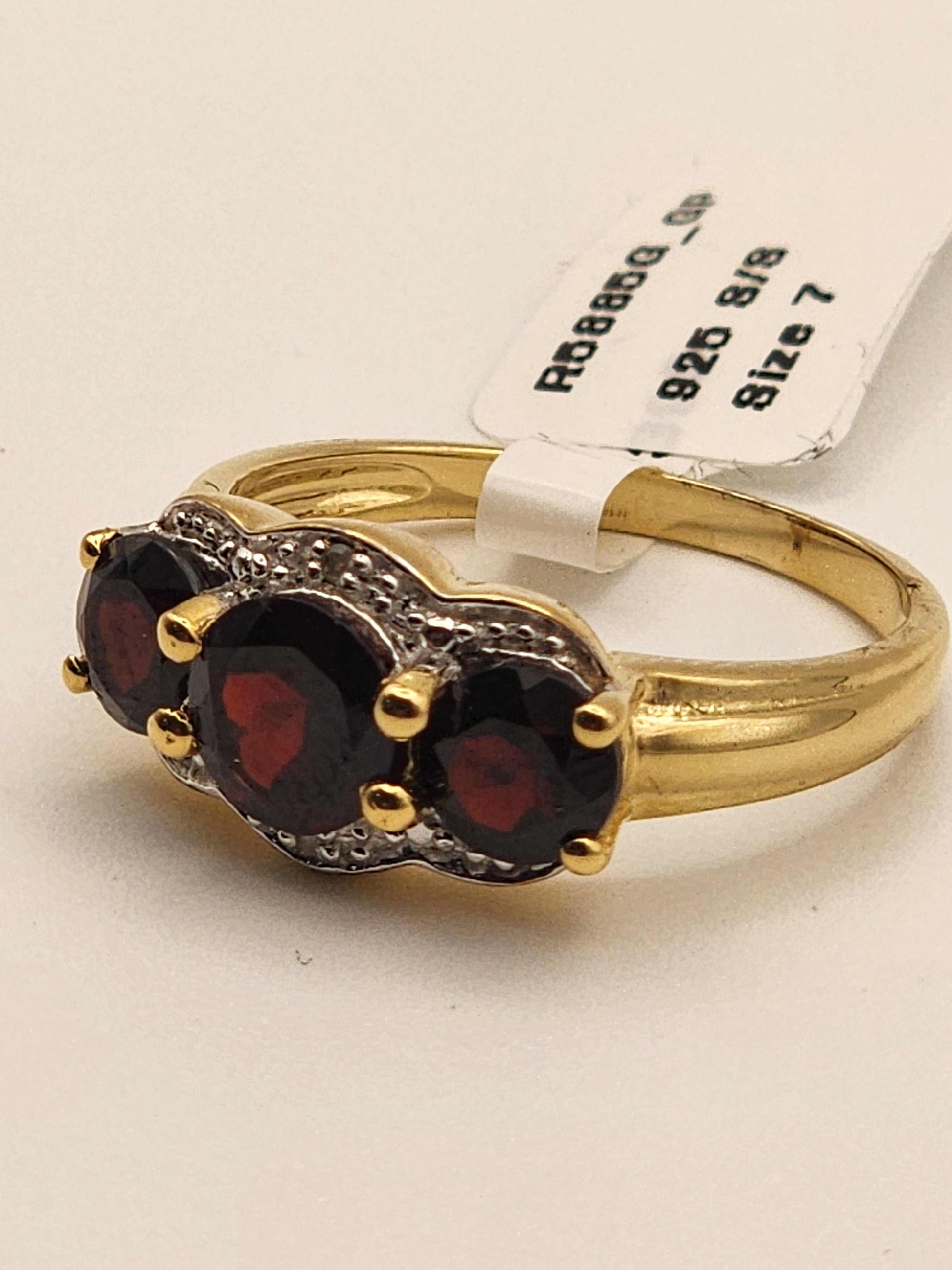 Women’s 14K yellow gold over sterling silver garnet and diamond ring size 7 with 2.3 carat round-cut garnet and diamond accent