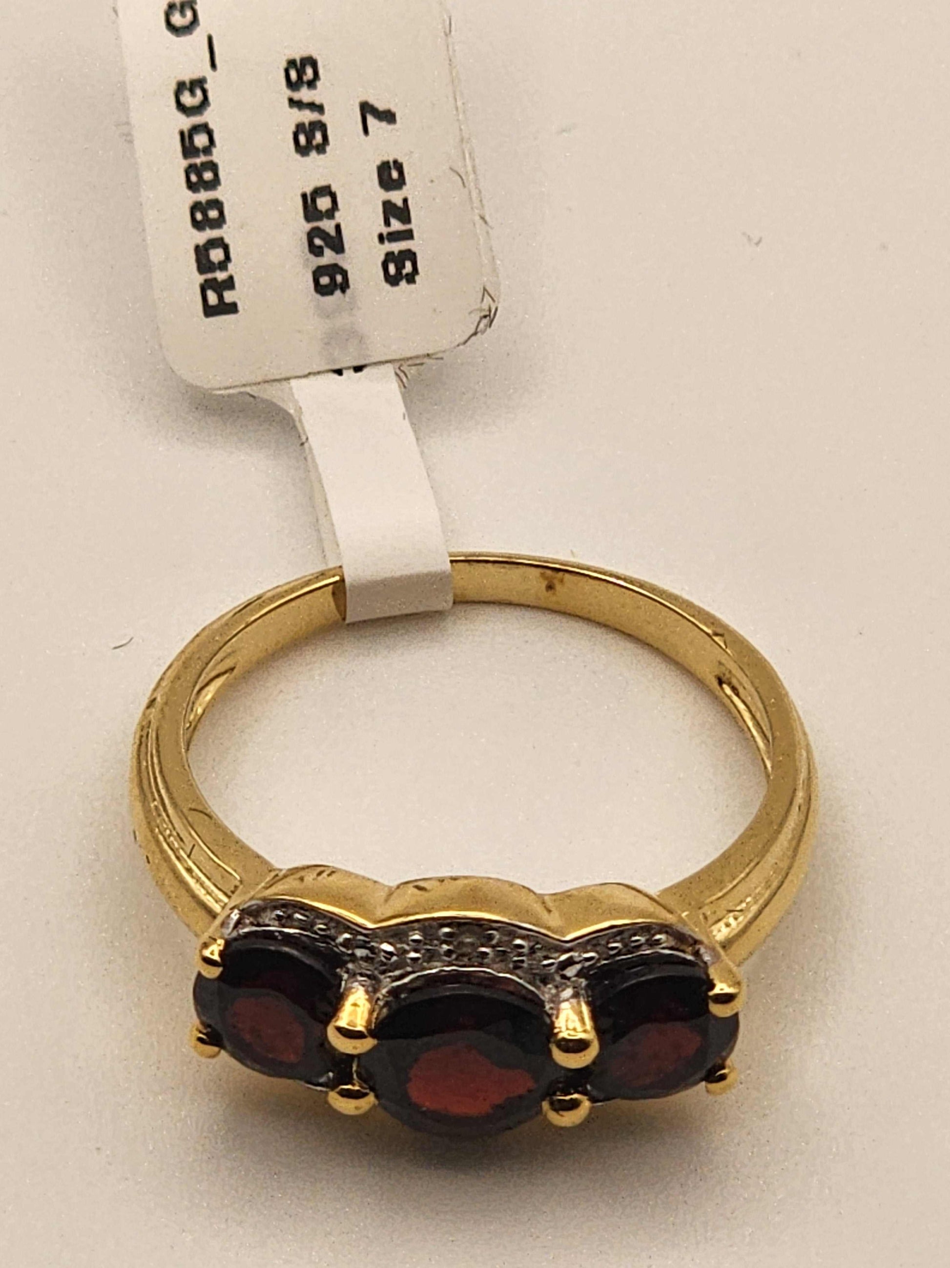 Women’s 14K yellow gold over sterling silver ring with 2.3 carat garnet and diamond, size 7