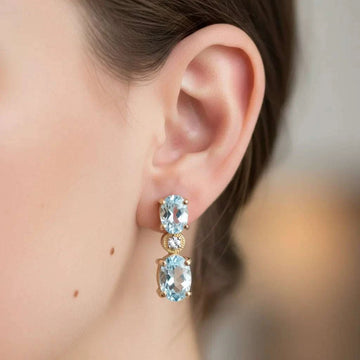 Gorgeous womens earrings featuring 18K yellow gold over sterling silver with Swiss blue topaz and diamonds