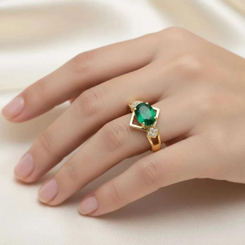 Women 14K yellow gold ring with oval emerald and round diamonds on hand size 7