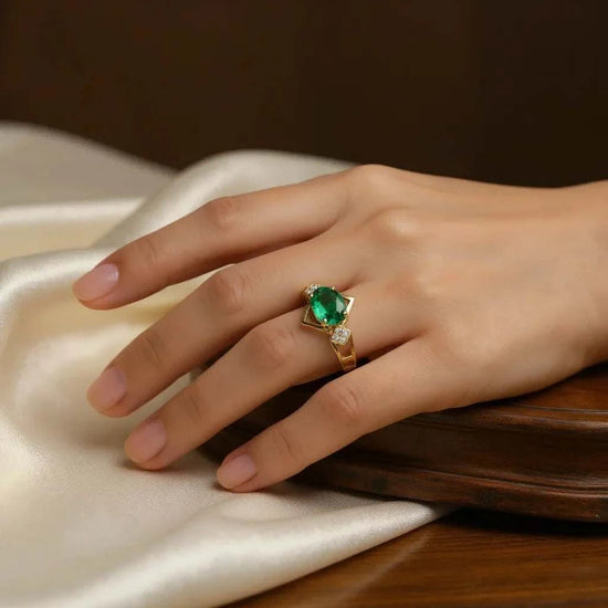 Women 14K yellow gold ring with oval emerald and round diamond on hand size 7