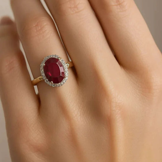 Women’s 14K yellow gold ring with 3.0 CTW ruby and diamond halo, size 7