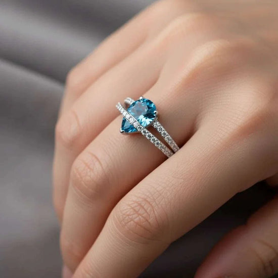 Women’s 14K white gold ring with pear-cut Swiss blue topaz and round diamonds size 7
