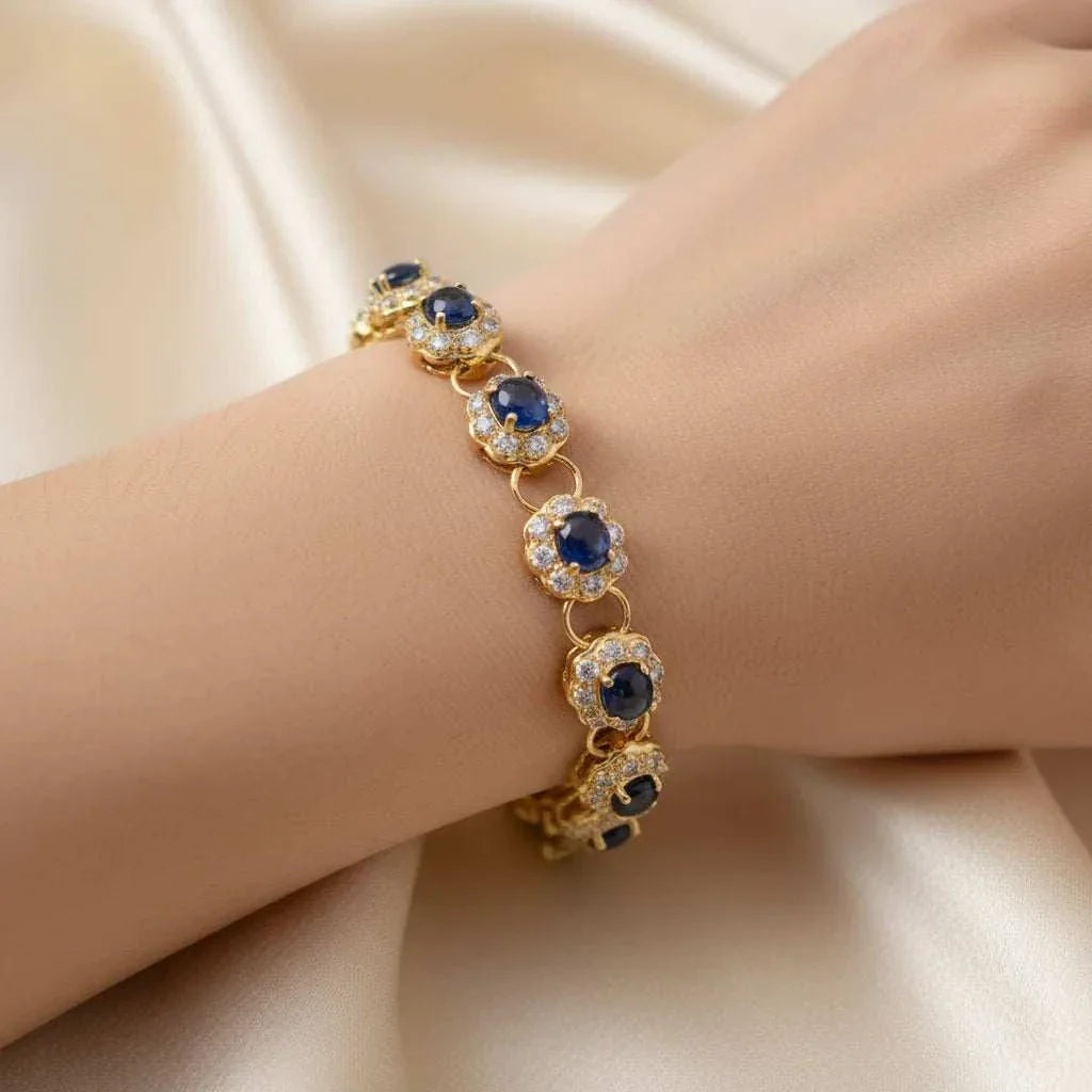 Elegant diamond and sapphire bracelet with deep blue oval sapphires and round diamonds set in 18K gold plated sterling silver