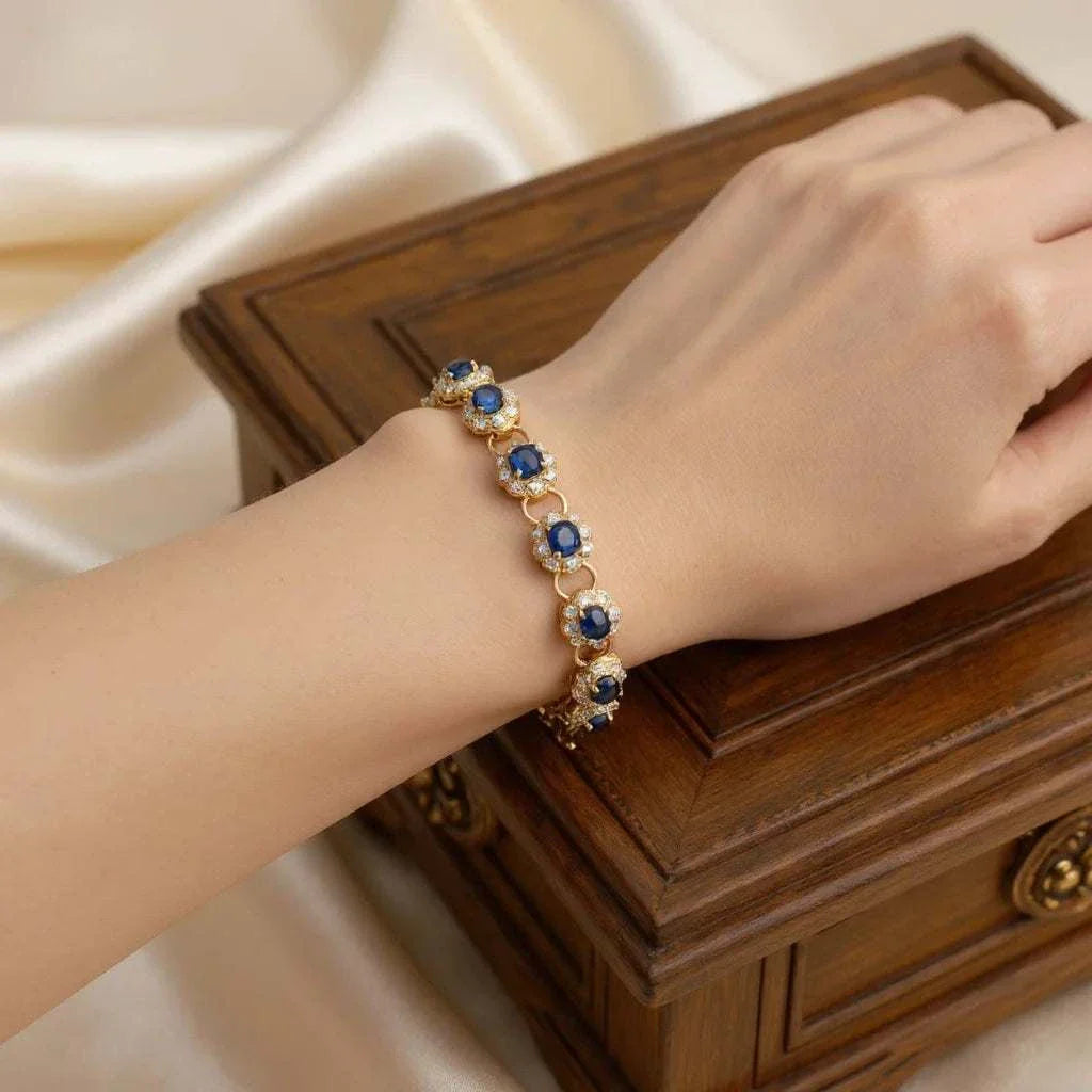 Diamond and sapphire bracelet with deep blue oval sapphires and round diamonds in 18K gold plated sterling silver