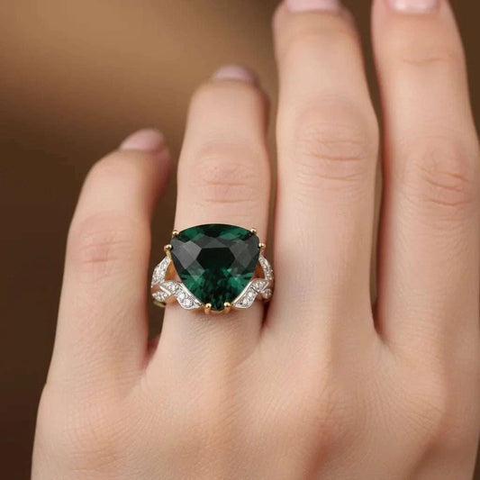 Women’s 14K white gold over silver ring with 6.85 CTW trillion-cut emerald and diamond accents on hand