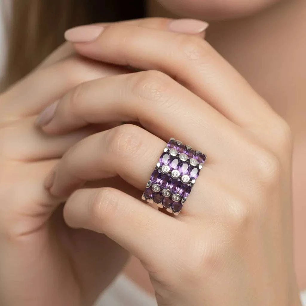 Women’s 14K white gold over silver ring with 3.60 CTW oval amethyst and diamond accents on finger