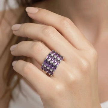 Women’s 14K white gold over silver ring with 3.60 CTW oval amethyst and diamond accents on hand