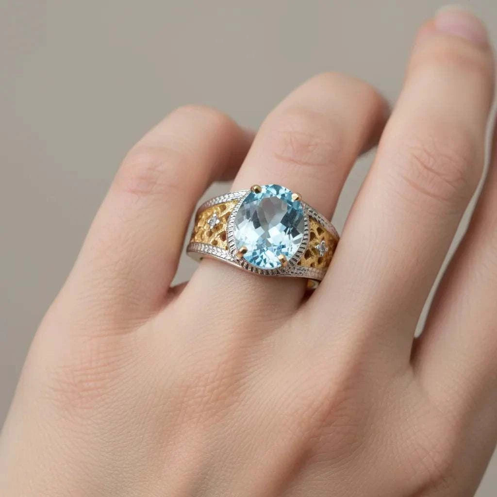Women’s 14K gold over silver ring with oval-cut Swiss blue topaz and diamond accents on finger size 7