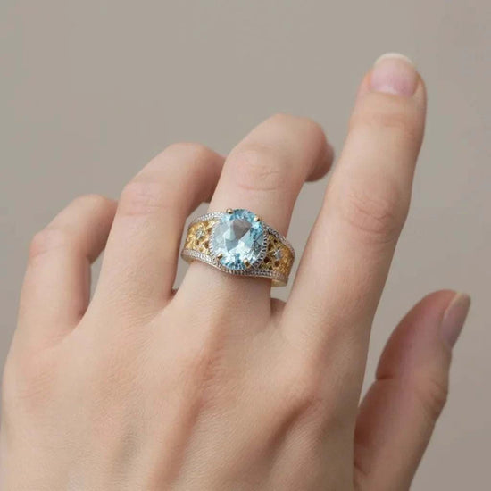 Women’s 14K gold over silver ring with oval-cut Swiss blue topaz and diamond accents, size 7