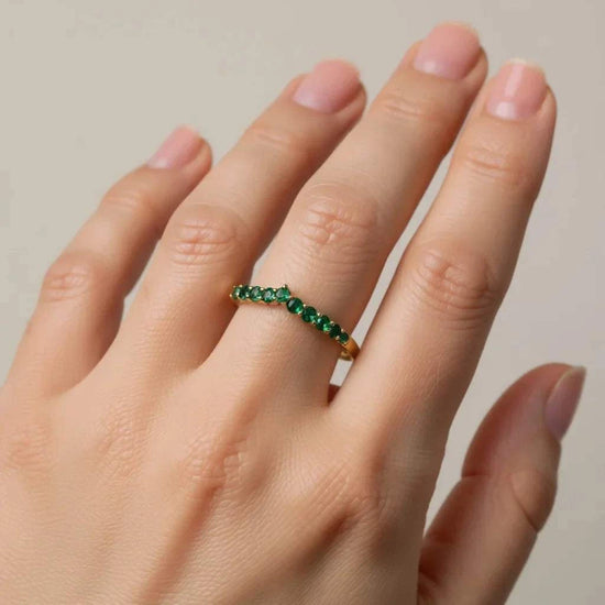 10K yellow gold emerald designer ring on woman's hand vibrant green stones size 7