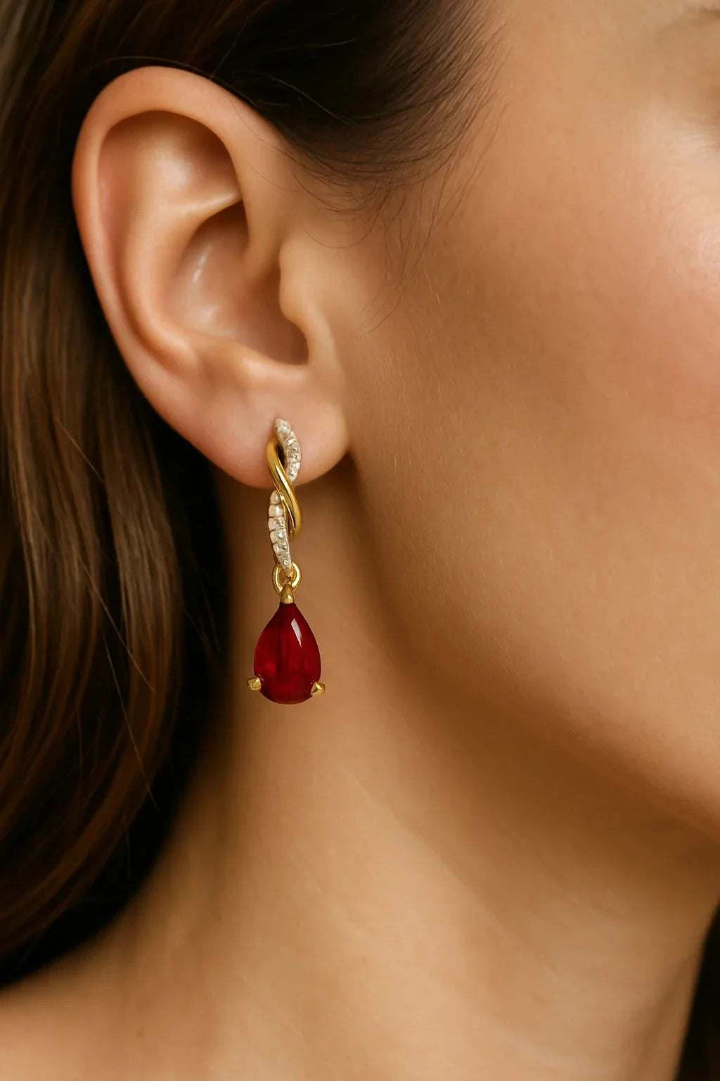 Women’s 14K yellow gold earrings with pear-cut ruby and round diamonds in teardrop design