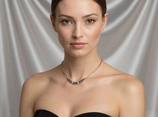 Women’s 18K yellow gold over sterling silver necklace with round-cut sapphires and diamonds worn by woman