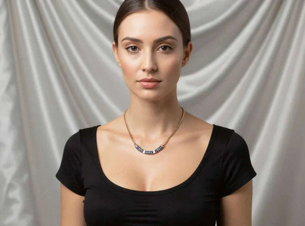 Women’s 18K yellow gold over sterling silver necklace with sapphires and diamonds worn by woman in black top