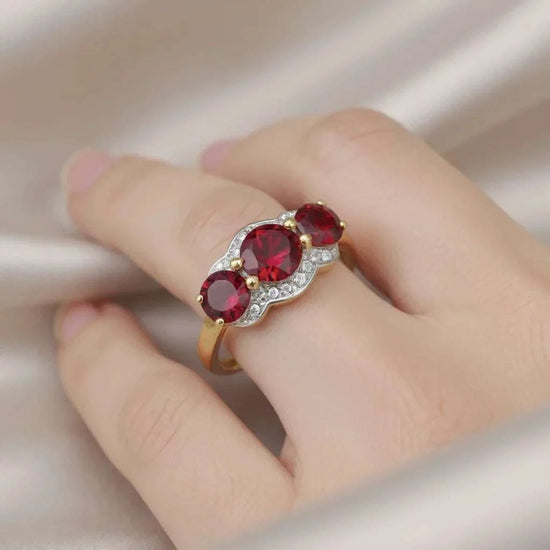 Women’s 14K yellow gold over sterling silver ring with 2.3 carat round-cut garnet and diamond accents, size 7