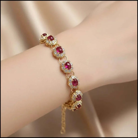 18K yellow gold sterling silver bracelet with oval ruby and diamond accents on wrist