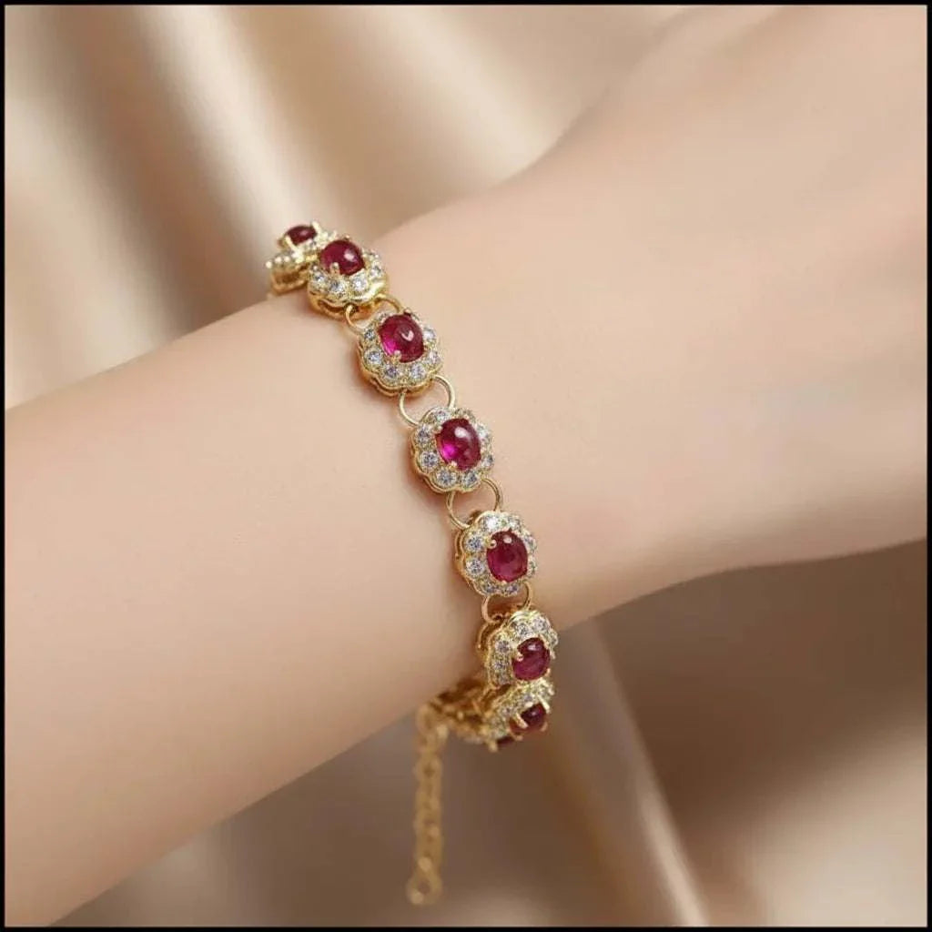 18K yellow gold sterling silver bracelet with oval ruby and diamond accents on wrist