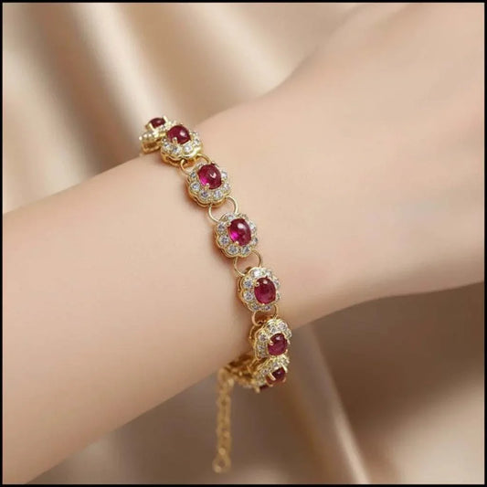 18K yellow gold sterling silver bracelet with oval ruby and diamond accents on wrist