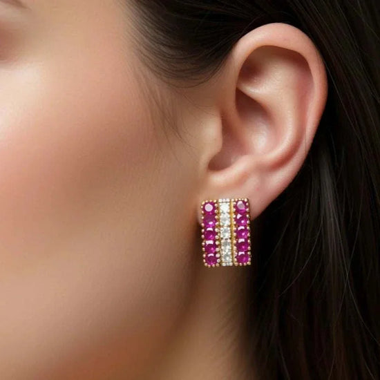 Women’s 18K yellow gold plated earrings with rubies and diamonds close-up on ear