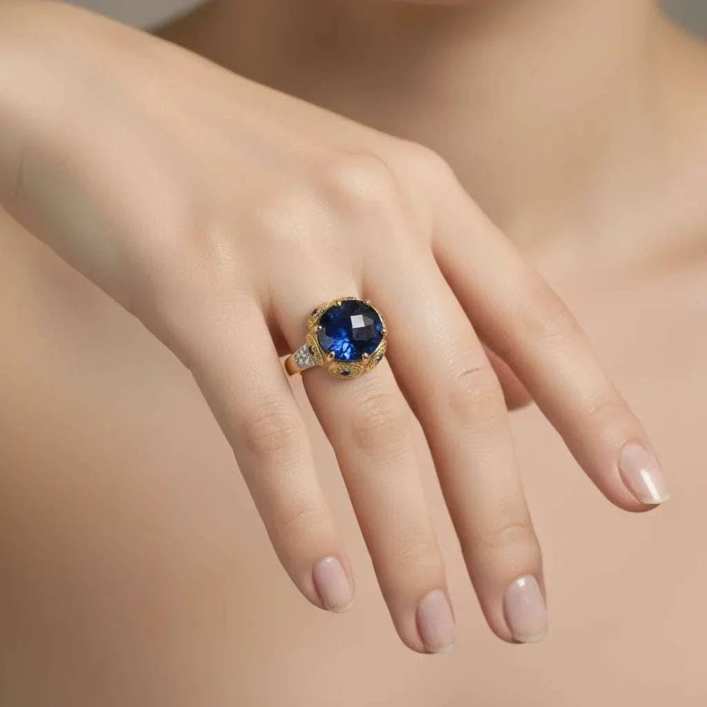 Elegant women's 14K gold over silver ring with a large blue sapphire centerpiece and diamond accents on size 7 hand