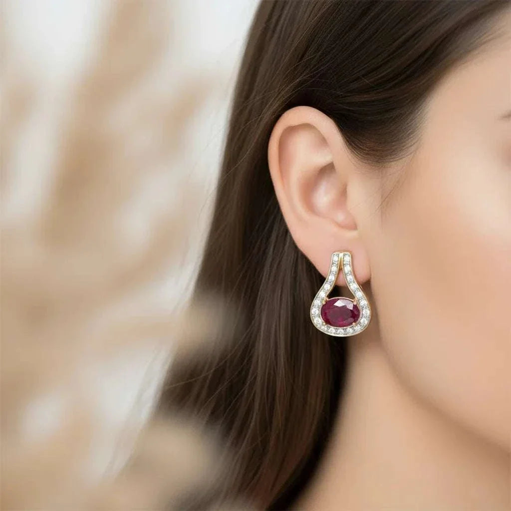 Women’s 18K yellow gold over sterling silver ruby and diamond teardrop earrings worn by model