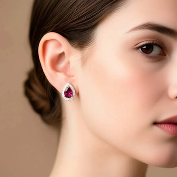 18K yellow gold over sterling silver women's garnet and diamond droplet earrings worn on ear