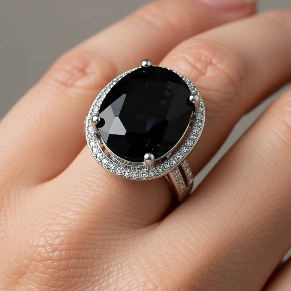 Women's 14K white gold sapphire and diamond ring with large oval black sapphire centerpiece and diamond accents