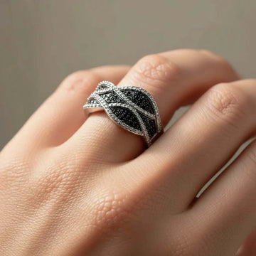 Elegant women's designer ring with black and white diamonds in sterling silver and 14K white gold layering, size 7