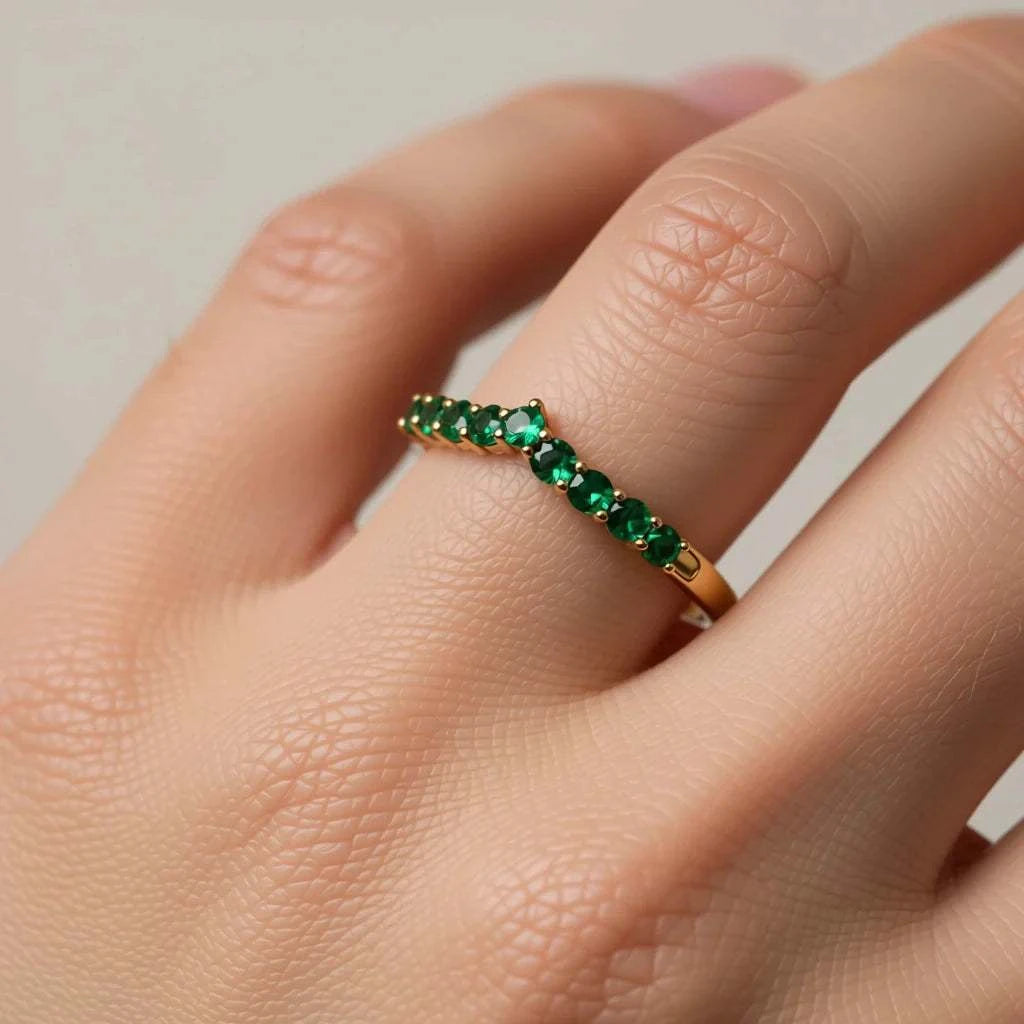 Women’s 10K yellow gold emerald designer ring with round-cut green stones on finger size 7
