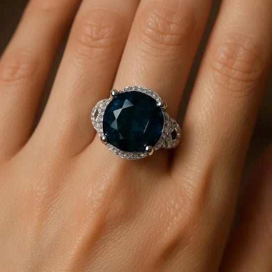 Gorgeous women’s 14K white gold over sterling silver ring with large dark blue gemstone and diamond accents