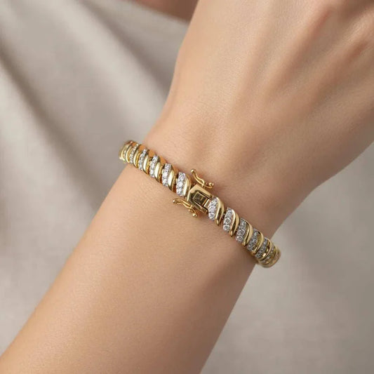Women’s 18K yellow gold over sterling silver diamond bracelet on wrist with round-cut diamonds